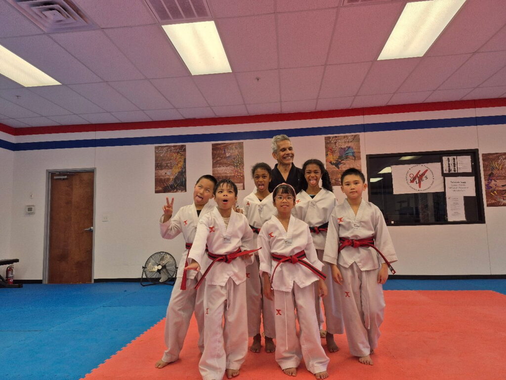 Students and Master Gonzalez having fun together after a Taekwondo class at Chang Lee's Taekwondo in Allen, TX